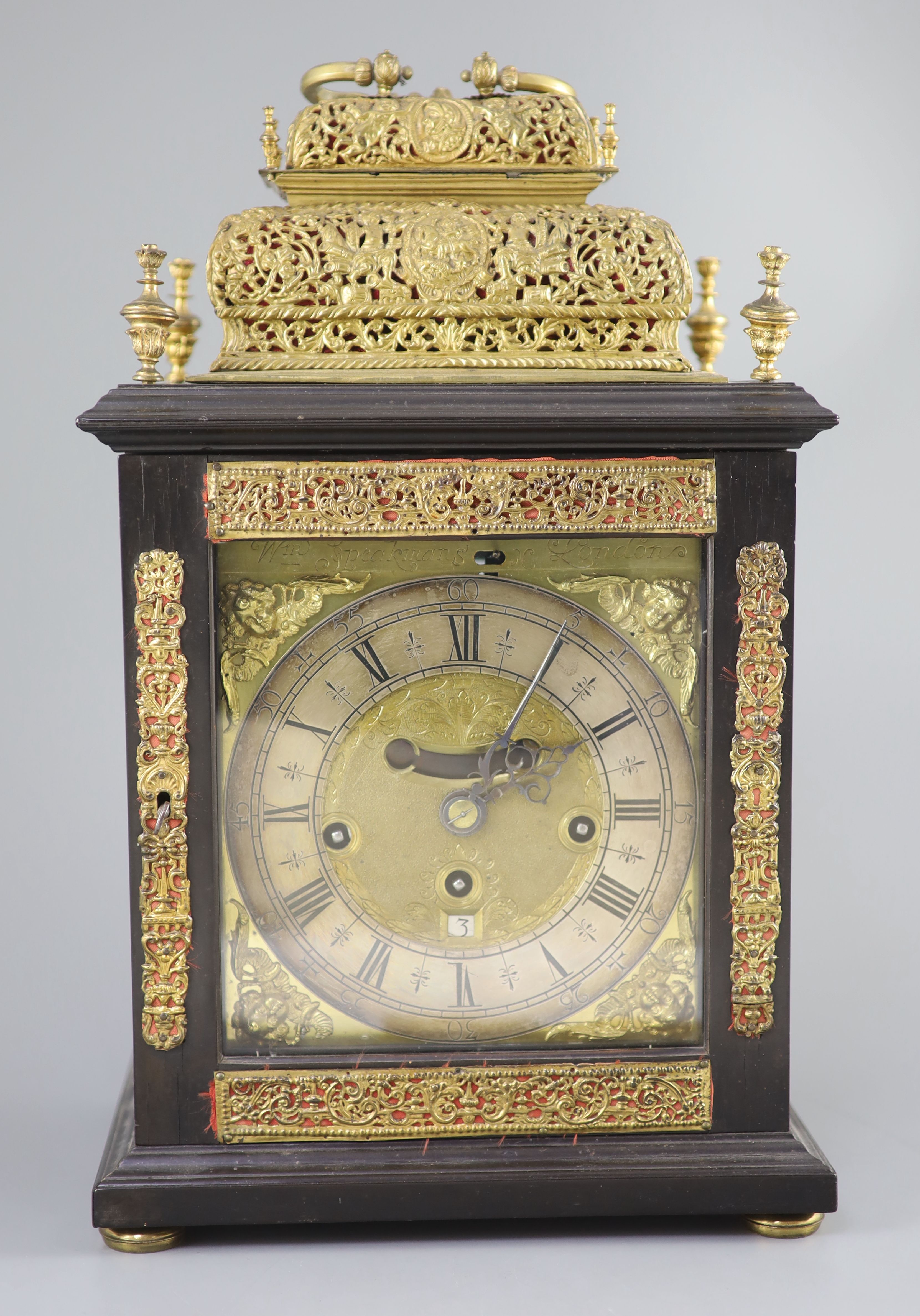 A William III ebonised cased and gilt metal double basket topped chiming and quarter repeating table clock, height 17in.